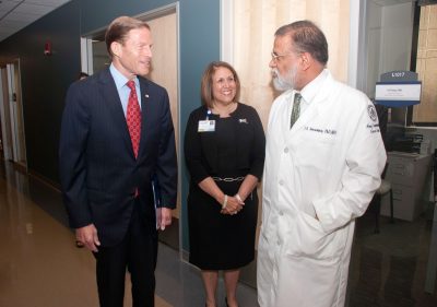 U.S. Sen. Richard Blumenthal speaking to Anne Diamond Chief Executive Officer, John Dempsey Hospital, and Dr. Pramod Srivastava during his recent visit to UConn Health. 