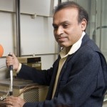 Challa Kumar, professor of Chemistry, in his lab working with a CO2 Sequestering Machine he and some of his graduate students constructed.