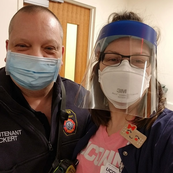 John and Jennifer Pickert in unform and personal protective equipment